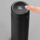 Insulated golf bottle in black with digital display screen on lid